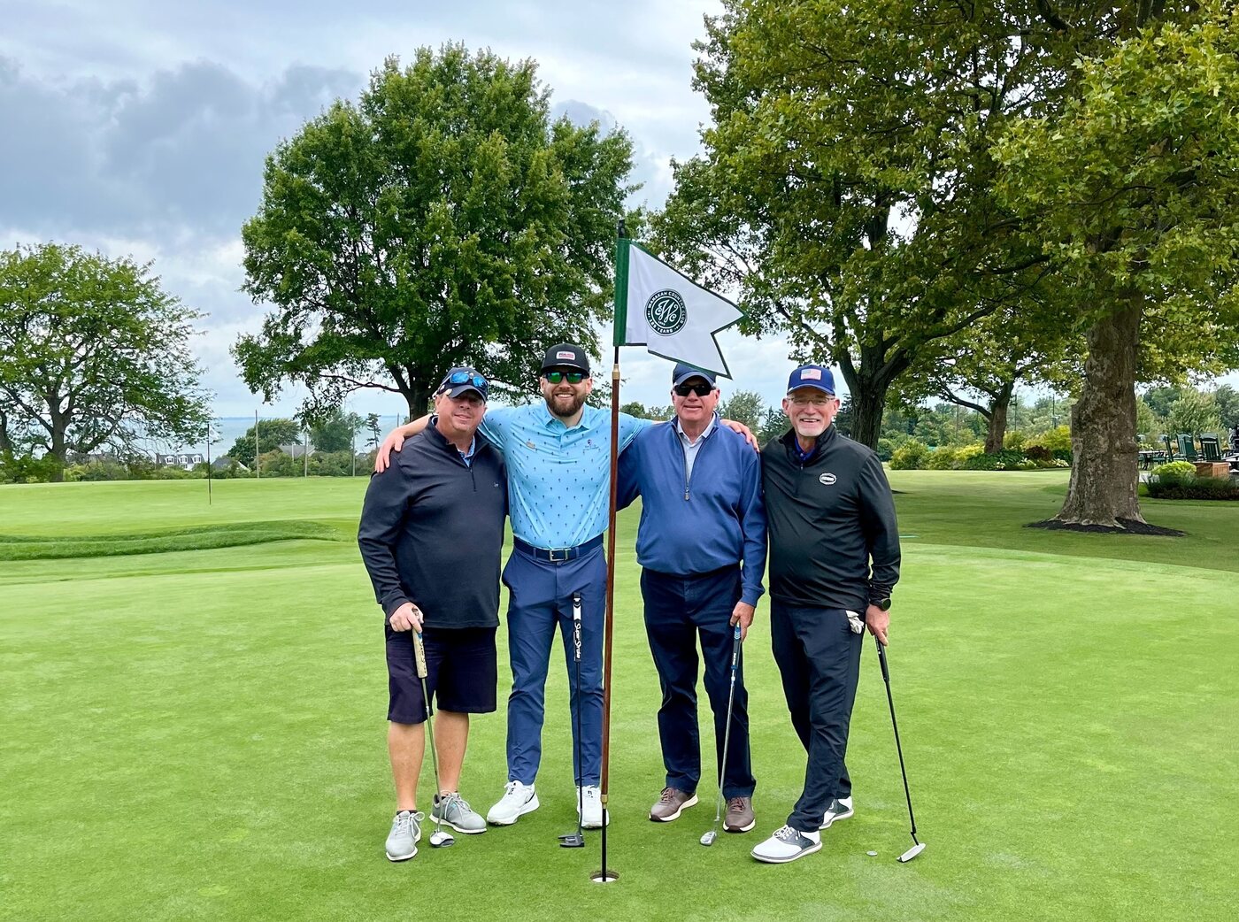 Foursome at the flag